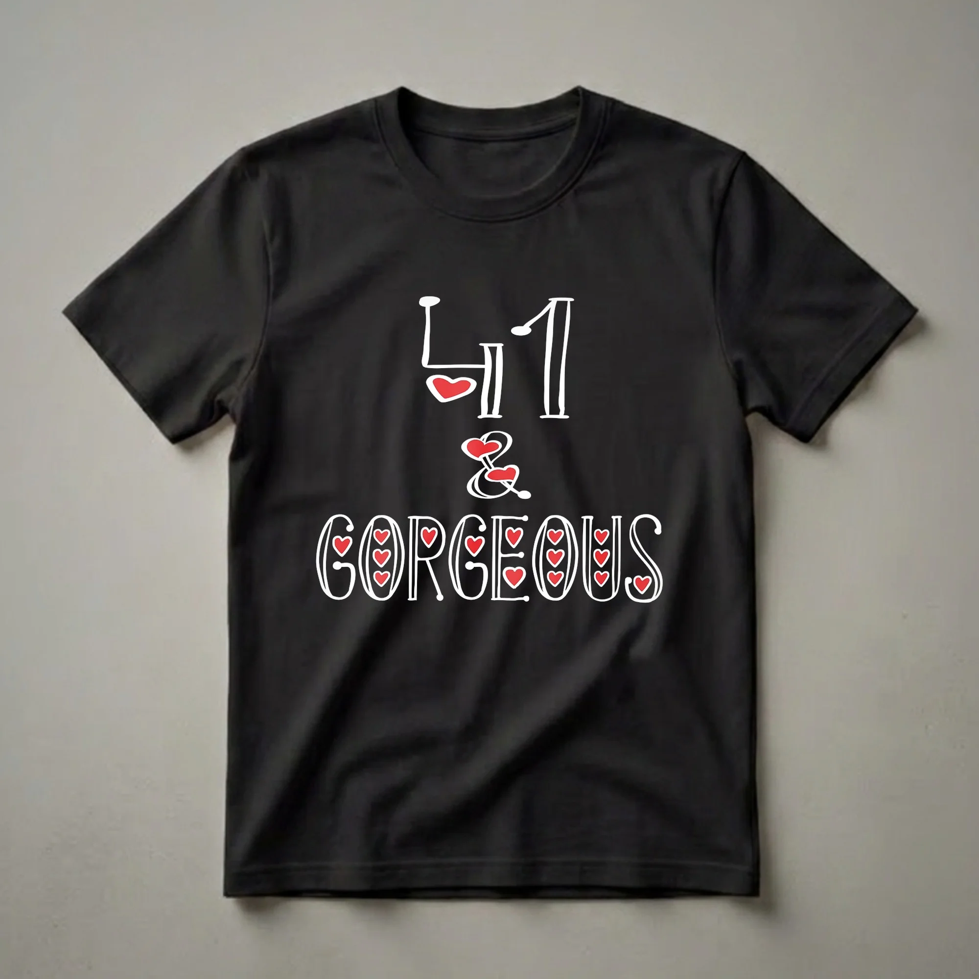 Black t-shirt with white text that reads '41 & GORGEOUS', accented with red hearts, celebrating a 41st birthday for women.