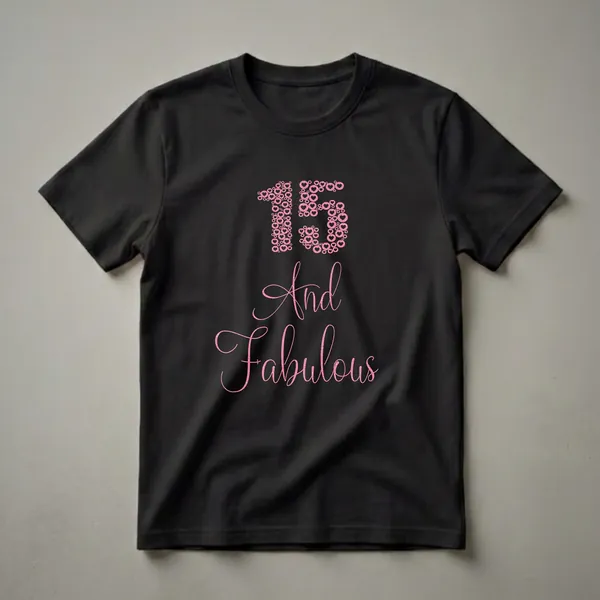 Black t-shirt with a graphic design featuring the number 15 made of pink glitter hearts and circles, followed by the script text 'And Fabulous' in pink glitter.