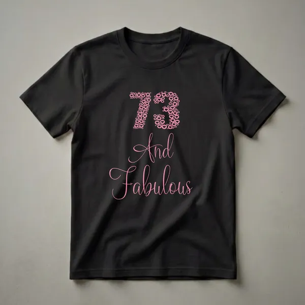Black t-shirt with the number 73 and the words 'And Fabulous' in pink glittery hearts and circles, celebrating a 73rd birthday.