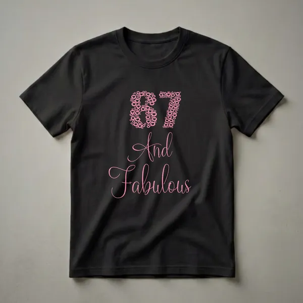 Black t-shirt with '87' formed from pink glitter hearts and 'And Fabulous' in pink glitter script.