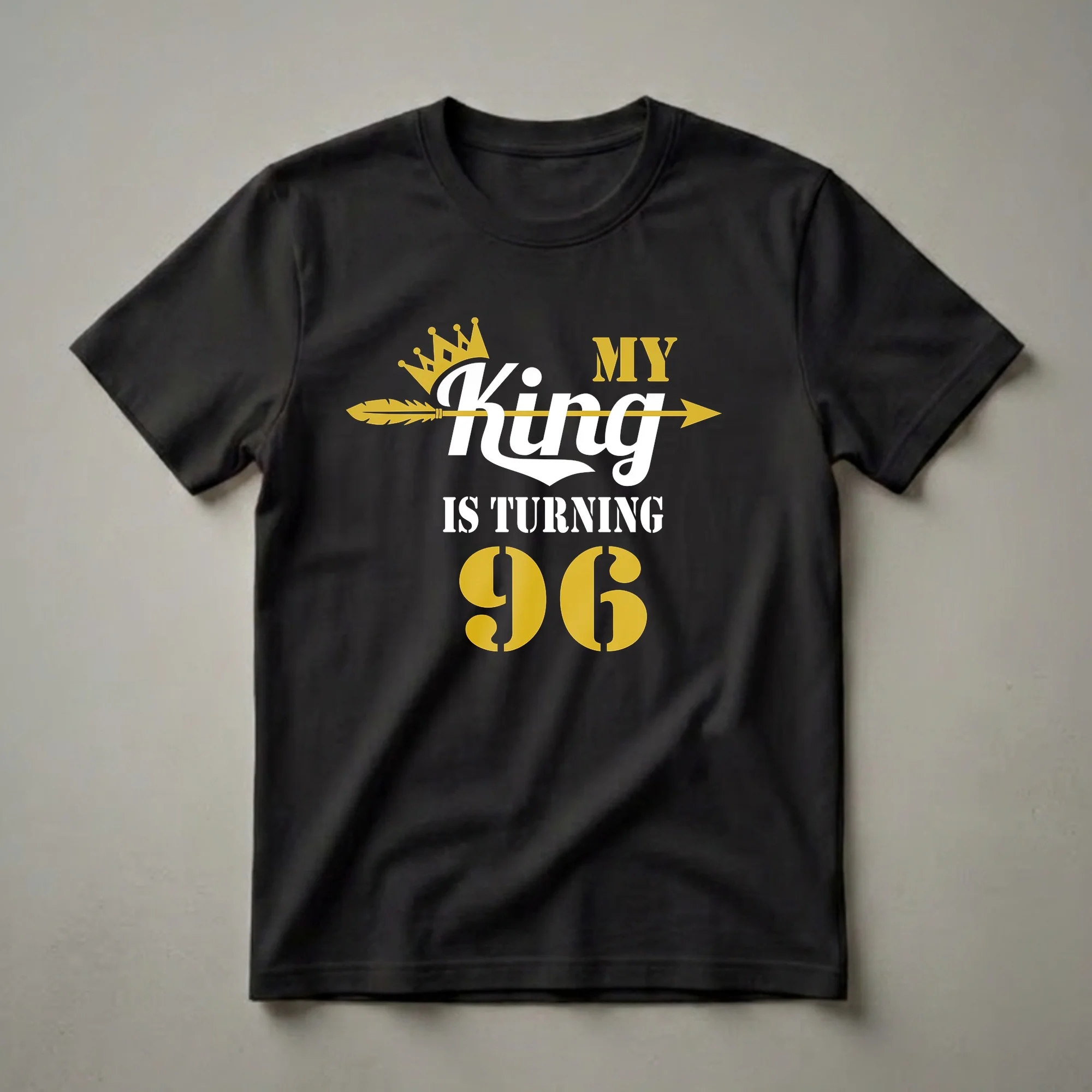 Black t-shirt with white and gold text that reads 'My King Is Turning 96' with a crown and arrow graphic.
