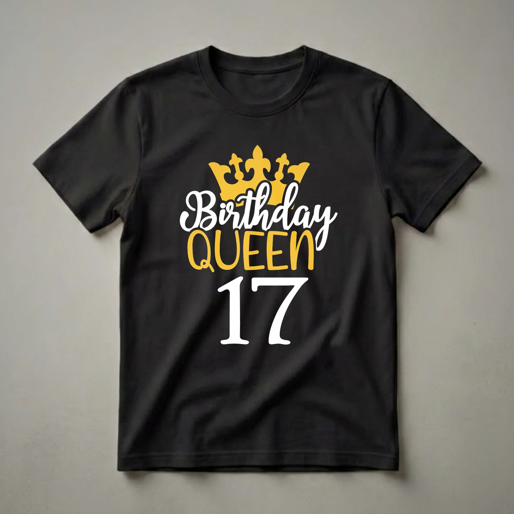 Black t-shirt with a graphic design featuring a golden crown, the words 'Birthday Queen' in white and gold, and the number '17' in white.