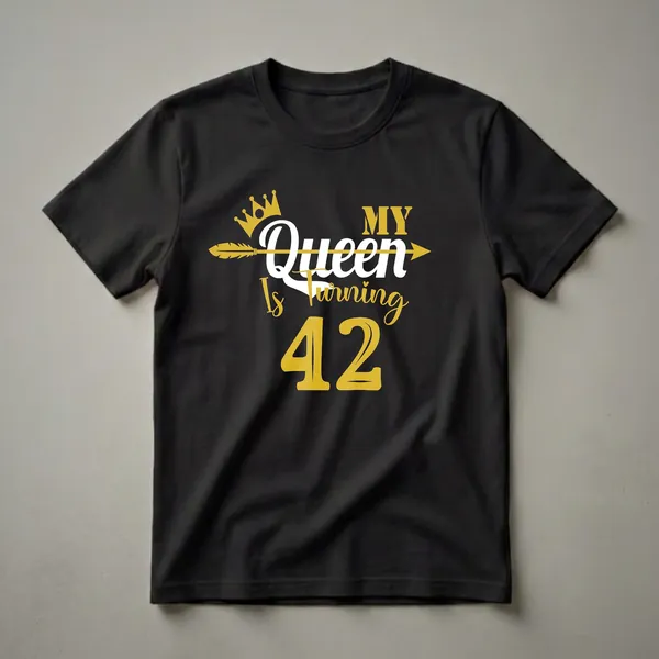 Black t-shirt with a gold crown, gold arrow, white 'Queen', gold 'MY', gold 'Is Turning', and gold '42' graphic.