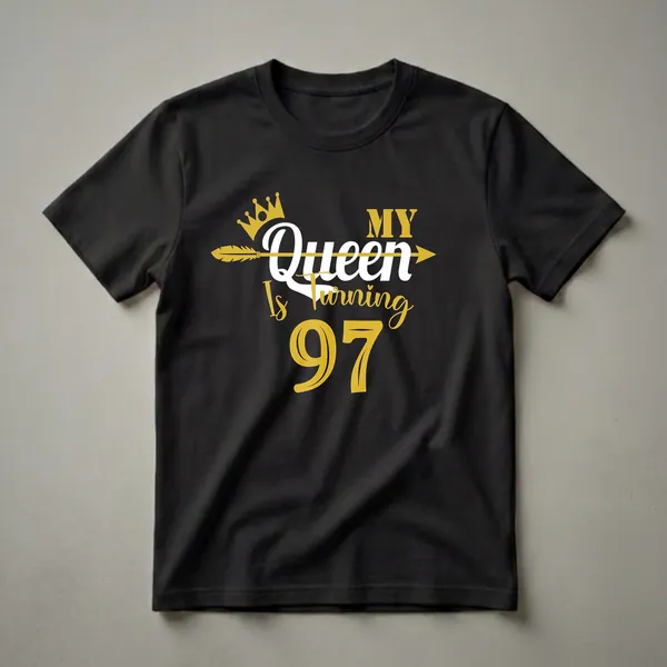 Black t-shirt with gold and white text that reads "My Queen Is Turning 97" with a crown and arrow graphic.