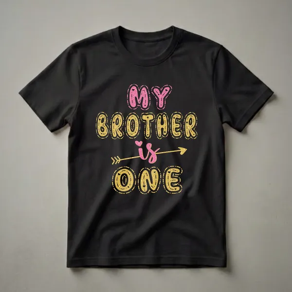Black t-shirt with 'MY BROTHER IS ONE' text graphic in glittery pink and gold letters, featuring an arrow and heart accents.