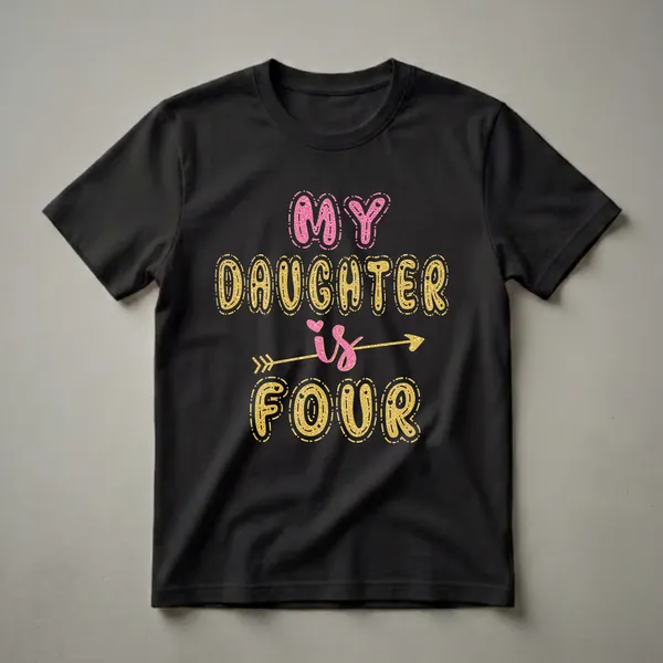 Black t-shirt with the text 'MY DAUGHTER IS FOUR' in glittery pink and gold bubble letters, with an arrow through the word 'IS'.