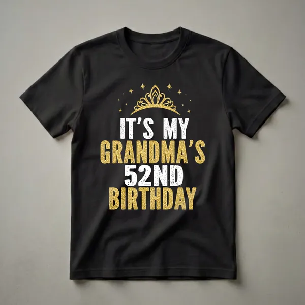 Black t-shirt with white and gold glitter-effect text that reads 'IT'S MY GRANDMA'S 52ND BIRTHDAY', topped with a golden crown and surrounded by golden stars.
