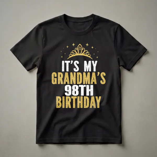 Black t-shirt with white and gold glitter text that reads "IT'S MY GRANDMA'S 98TH BIRTHDAY" and a gold crown graphic with stars.