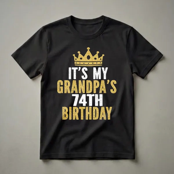 Black t-shirt with a gold glitter crown and distressed white and gold text that reads 'IT'S MY GRANDPA'S 74TH BIRTHDAY'.