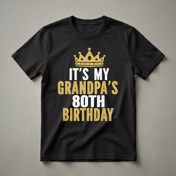 Black t-shirt with a gold glitter crown graphic above distressed white and gold text reading 'IT'S MY GRANDPA'S 80TH BIRTHDAY'.