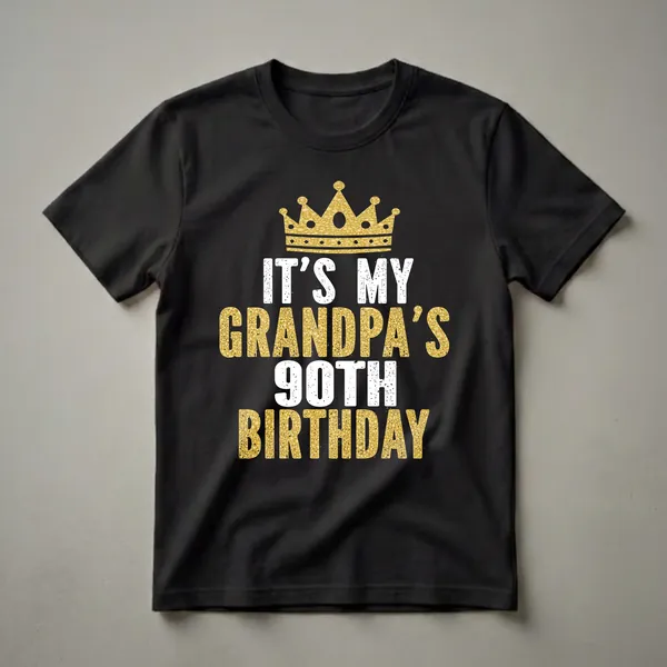 Black t-shirt with white and gold distressed lettering that reads 'IT'S MY GRANDPA'S 90TH BIRTHDAY' and a golden crown graphic above the text.