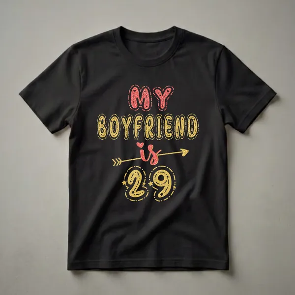 Black t-shirt with "MY BOYFRIEND is 29" in red and gold glitter lettering, featuring an arrow and stars.