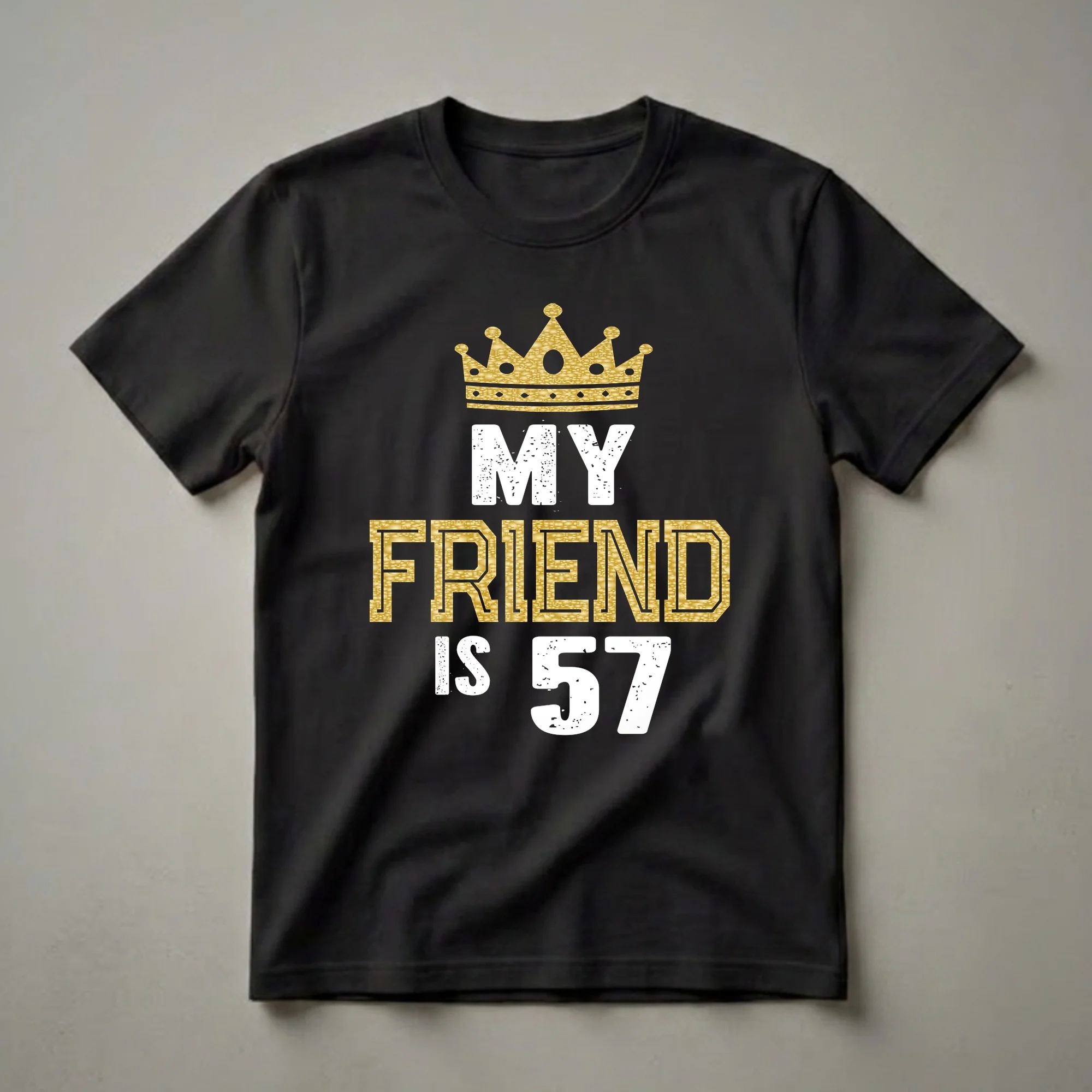 Black t-shirt with a gold glitter crown graphic above the words 'MY FRIEND IS 57' in distressed white and gold lettering.
