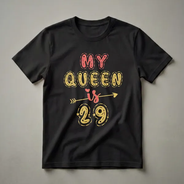 Black t-shirt with gold and red glitter-effect text that reads 'MY QUEEN is 29', decorated with hearts, stars, and an arrow.