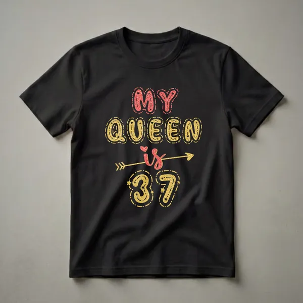 Black t-shirt with glittery red and gold text that reads 'MY QUEEN is 37' with decorative hearts, stars, and an arrow graphic.