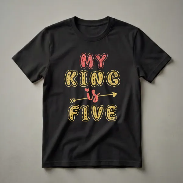 Black t-shirt with 'MY KING is FIVE' written in glittery red and gold bubble letters, with an arrow through the word 'is'.