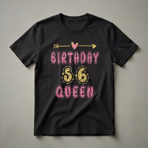 Black t-shirt with glittery pink text reading 'BIRTHDAY QUEEN' and gold text reading '56', adorned with gold arrows and a pink heart.