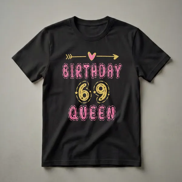 Black t-shirt with pink glittery letters spelling 'BIRTHDAY QUEEN' and gold glittery numbers '69' with stars and decorative arrows.