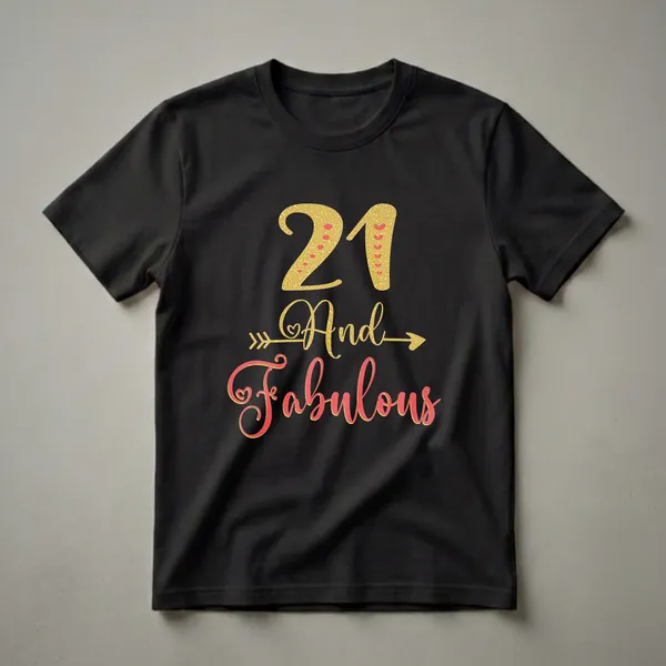 Black t-shirt with gold glitter '21' and 'And' with red heart accents, and coral glitter script 'Fabulous' with gold trim.