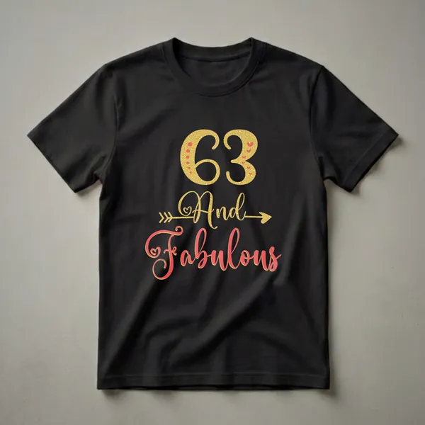 Black t-shirt with gold glitter '63' and 'And' with an arrow, and coral glitter 'Fabulous' with hearts, celebrating a 63rd birthday.