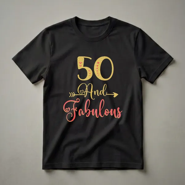 Gold glitter '50' with red hearts and dots, and red script 'And Fabulous' with gold glitter arrows, on a white t-shirt.