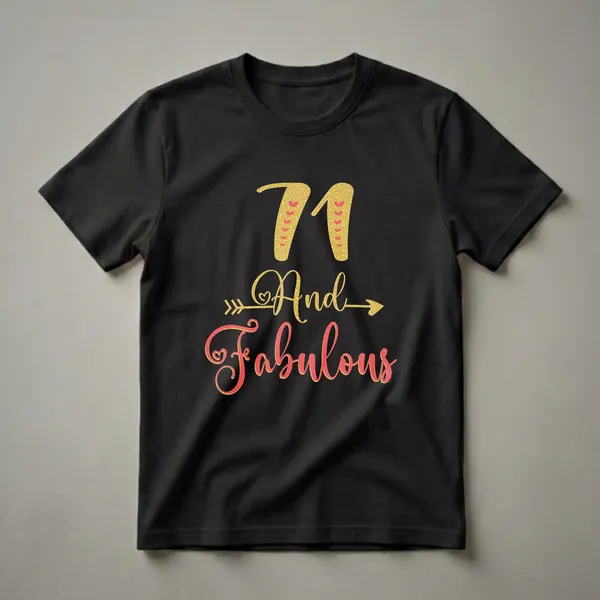 Black t-shirt with gold glitter '71' and red hearts, followed by 'And Fabulous' in gold and coral red glitter script with decorative arrows and hearts.