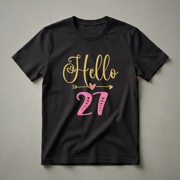 Black t-shirt featuring the text 'Hello 27' in gold and pink glitter fonts, with decorative hearts and arrows, celebrating a 27th birthday.