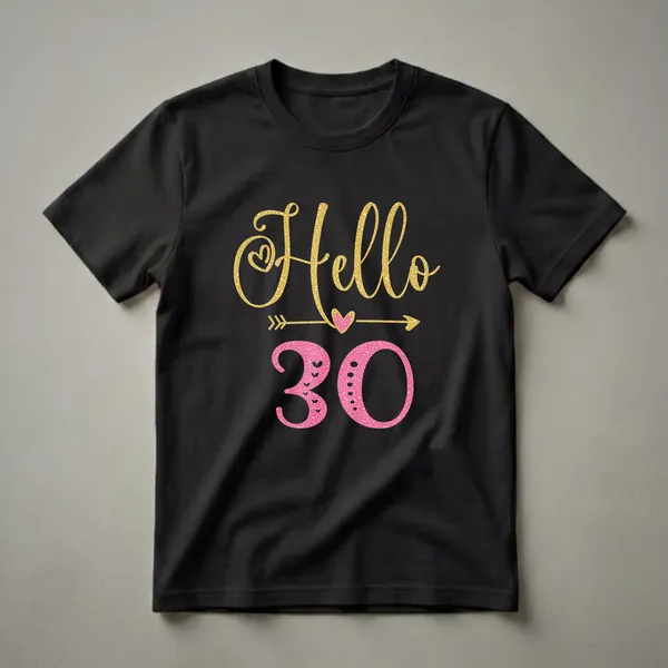 Black t-shirt featuring the text 'Hello 30' in gold glitter and pink textured fonts, with heart and arrow graphic elements.