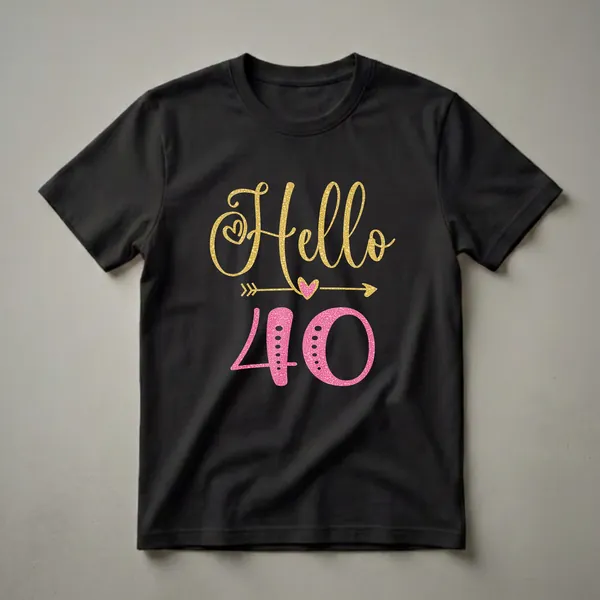 Black t-shirt with 'Hello 40' graphic. 'Hello' is in gold glitter script with a heart, and '40' is in pink glitter with dots and an arrow.