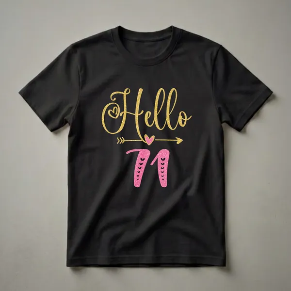 Black t-shirt featuring the text "Hello 71" in gold and pink glitter fonts, with decorative hearts and arrows.