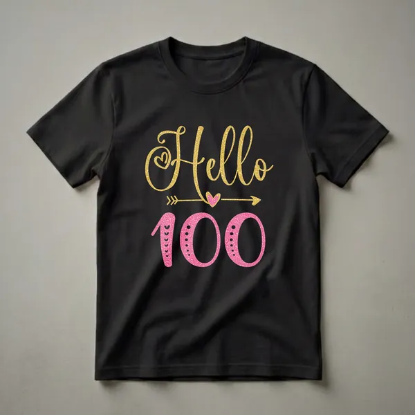 Black t-shirt with gold glitter 'Hello' and pink glitter '100' graphic, featuring decorative hearts and arrows for a 100th birthday celebration.