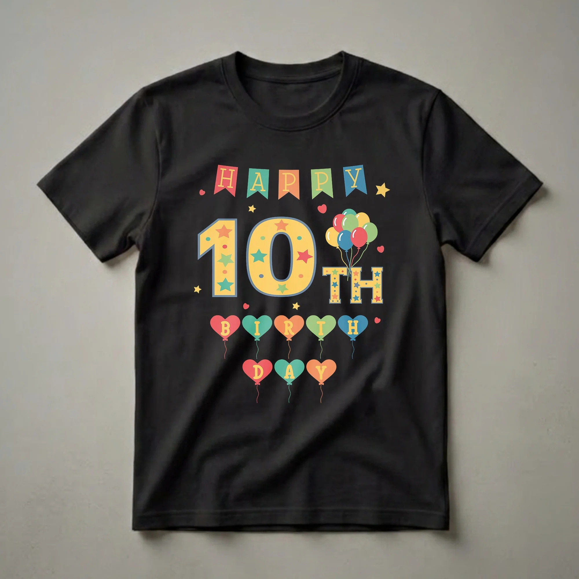 Black t-shirt with a colorful 'Happy 10th Birthday' graphic featuring banners, a large '10', balloons, and heart-shaped balloons spelling 'BIRTHDAY'.