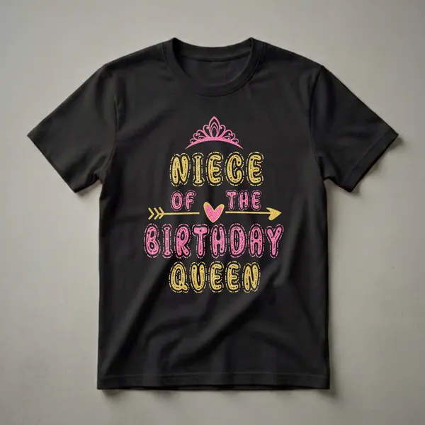Black t-shirt with the text 'NIECE OF THE BIRTHDAY QUEEN' in glittery gold and pink letters, topped with a pink crown and a gold arrow with a pink heart.