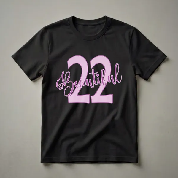Lilac and purple graphic t-shirt design featuring the number 22 with the word 'Beautiful' written in script, including a small heart accent.