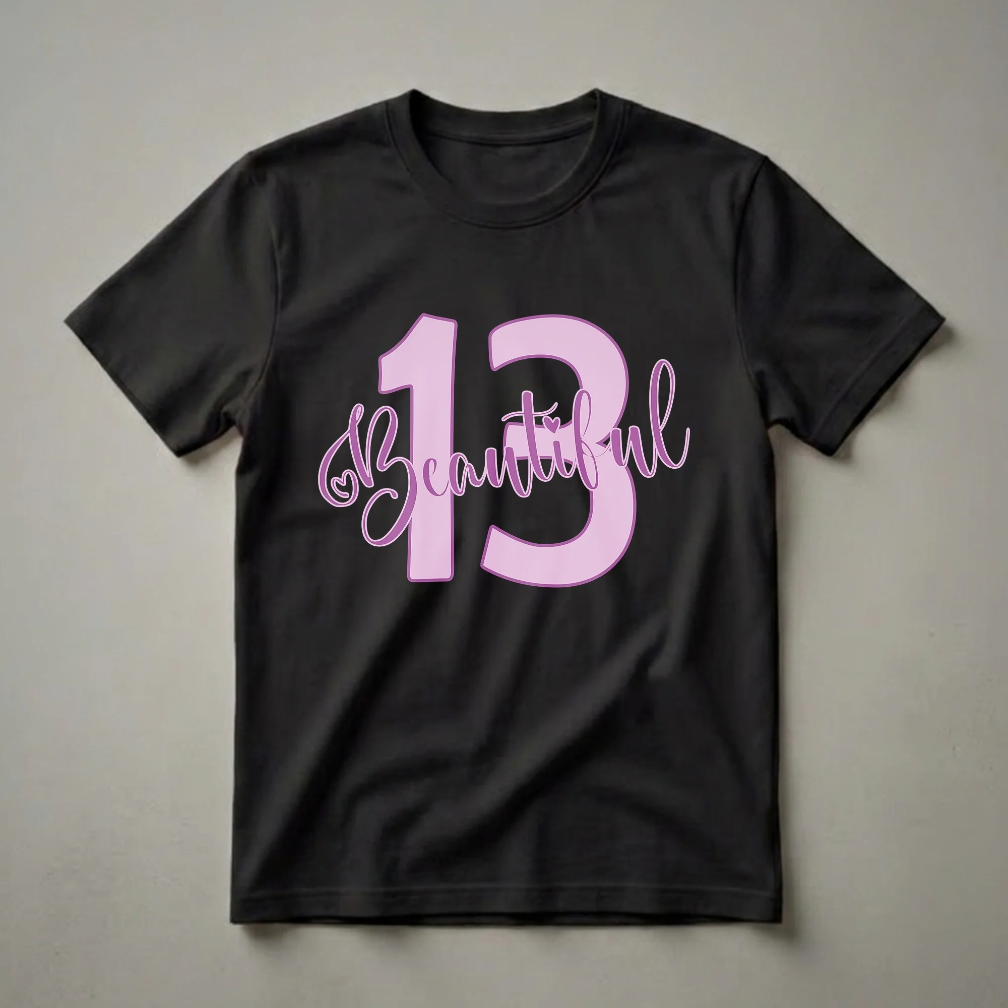 Light purple graphic t-shirt with the number 13 and the word 'Beautiful' in purple script font, featuring a small heart accent.