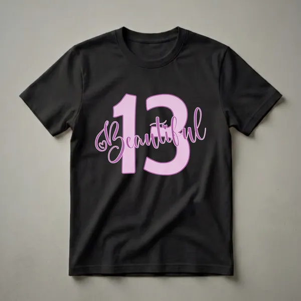 Light purple graphic t-shirt with the number 13 and the word 'Beautiful' in purple script font, featuring a small heart accent.