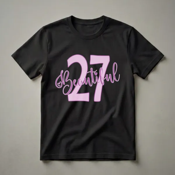 Graphic t-shirt design with the number 27 in light purple with a darker purple outline, and the word 'Beautiful' in script font in purple, with a small heart detail.