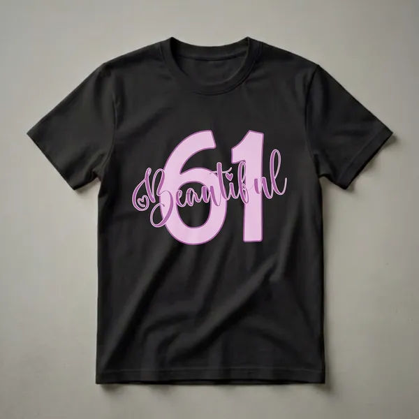 Light purple graphic t-shirt with the number 61 and the word 'Beautiful' in a darker purple script font, featuring a small heart detail.
