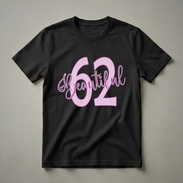 Light purple graphic t-shirt with the number 62 and the word 'Beautiful' in a darker purple script font, featuring a small heart detail.