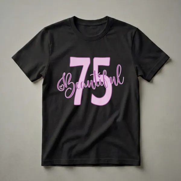 Light pink and purple graphic t-shirt featuring the number 75 and the word 'Beautiful' in script font with a heart accent, for a 75th birthday celebration.