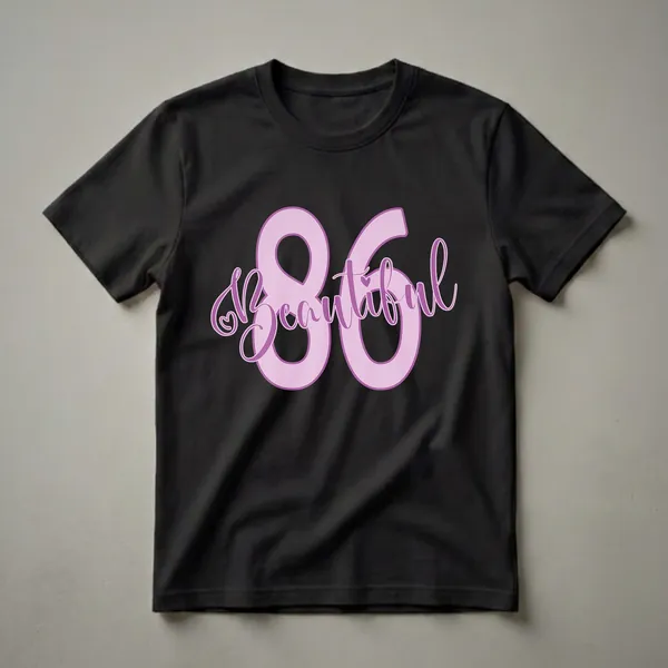 Light purple graphic t-shirt with large lavender numbers '86' and the word 'Beautiful' in script font, featuring a small heart detail.