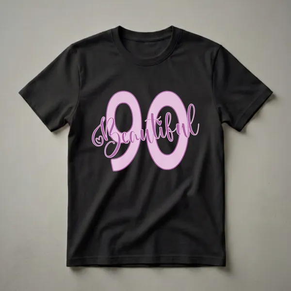 Light pink graphic t-shirt with '90' and the word 'Beautiful' in purple cursive, featuring small heart accents, for a 90th birthday celebration.