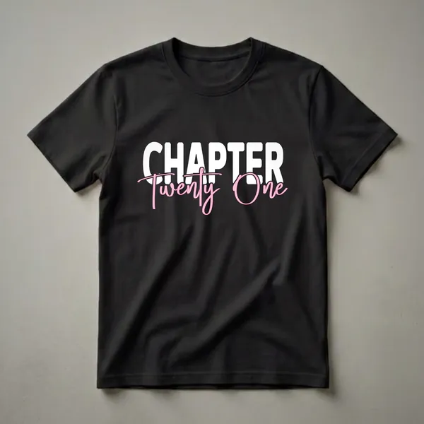 Black t-shirt with white bold text 'CHAPTER' and pink script text 'Twenty One' for a 21st birthday celebration.