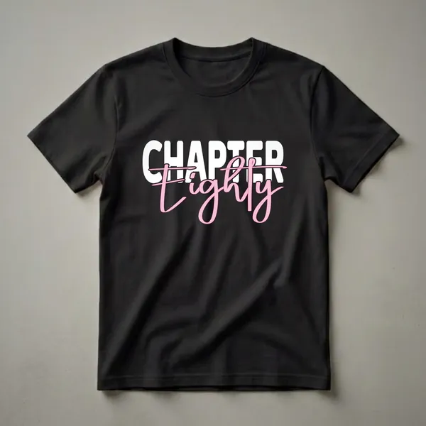 Black t-shirt with white block letters spelling 'CHAPTER' and pink script letters spelling 'Eighty' for an 80th birthday celebration.
