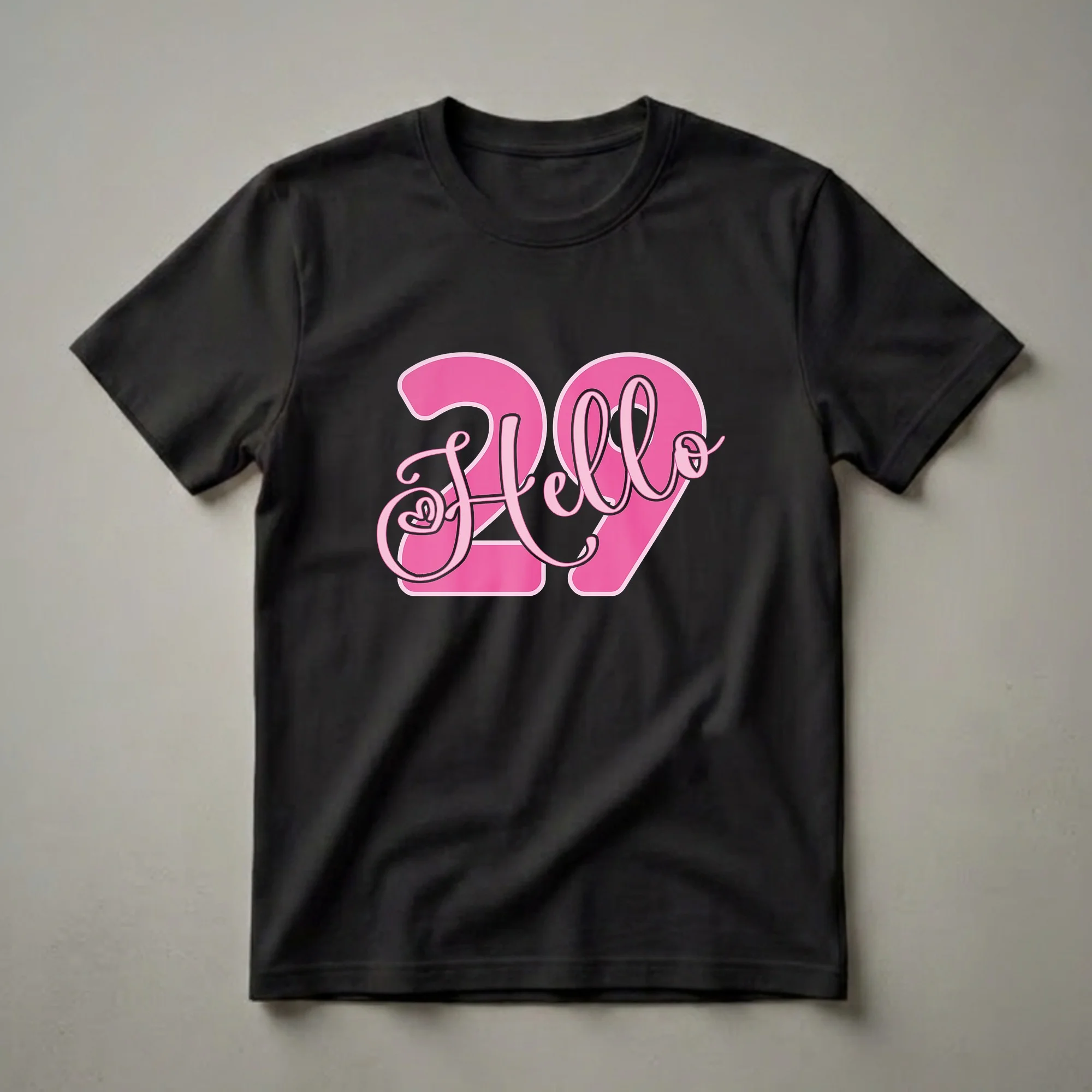 Black t-shirt with a graphic design featuring the number 29 in bright pink with a lighter pink outline, and the word 'Hello' in a pink script font overlaying the numbers.
