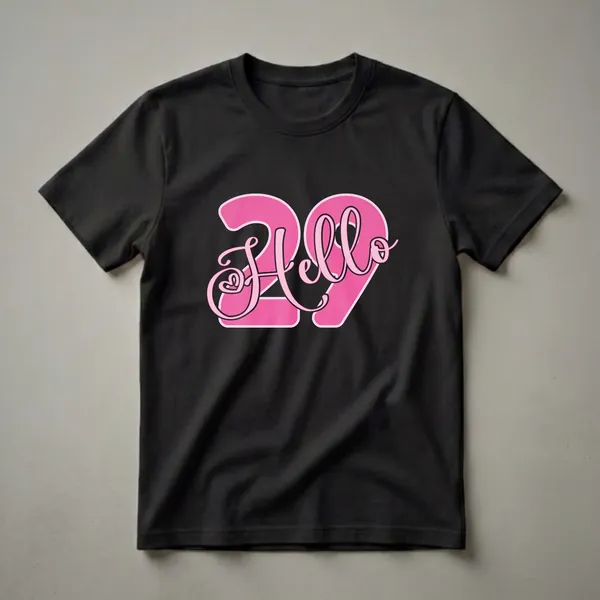 Black t-shirt with a graphic design featuring the number 29 in bright pink with a lighter pink outline, and the word 'Hello' in a pink script font overlaying the numbers.