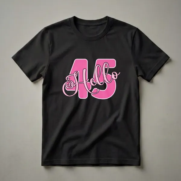 Pink graphic t-shirt with the number 45 and the word 'Hello' in a playful script font, designed for a woman's 45th birthday celebration.