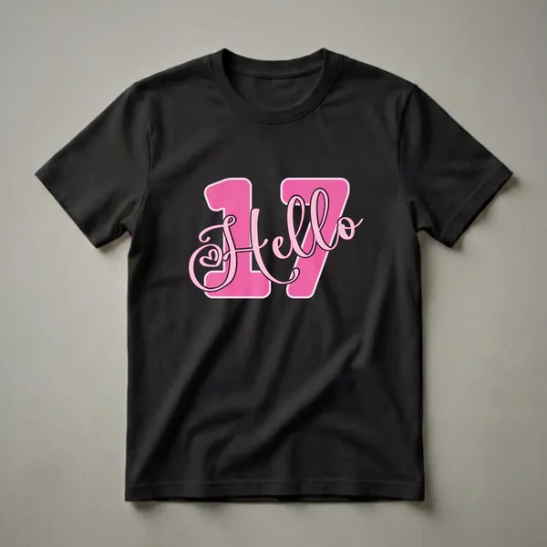Pink graphic t-shirt with bold pink numbers '17' and the word 'Hello' in script font, featuring a heart detail.