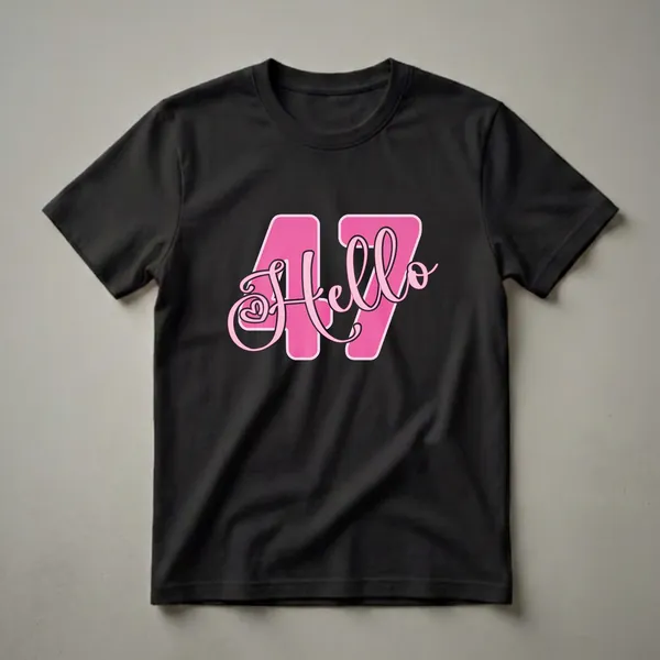 A black t-shirt featuring a graphic design with the number 47 in large pink block letters and the word "Hello" in pink script font.