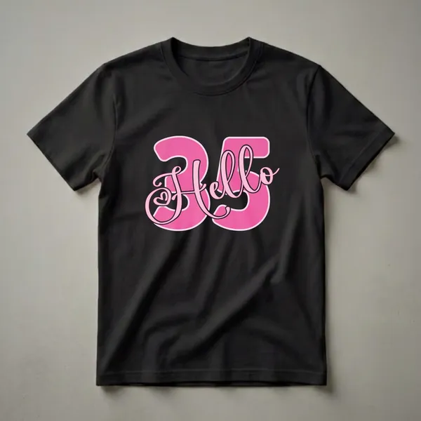 A graphic t-shirt design featuring the number 35 in large pink font with a script 'Hello' overlayed, a heart detail is present in the 'o' of 'Hello'.